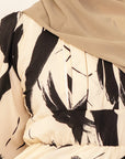 Rania monochrome print abaya, close view of the concealed nursing zip down the center front bodice