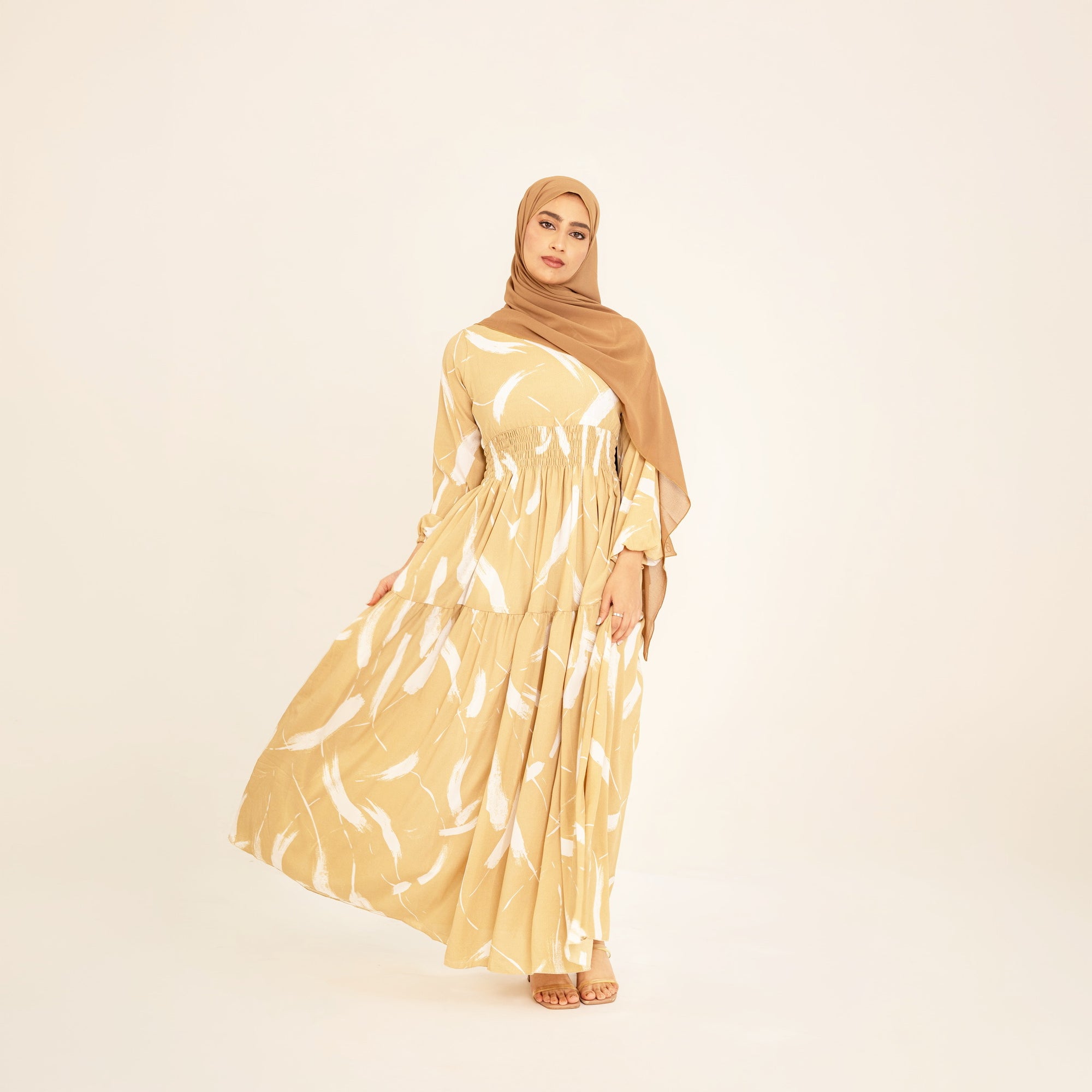 Noor champagne feather-print dress, skirt in movement