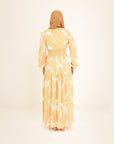 Noor champagne feather-print dress, back view, full length