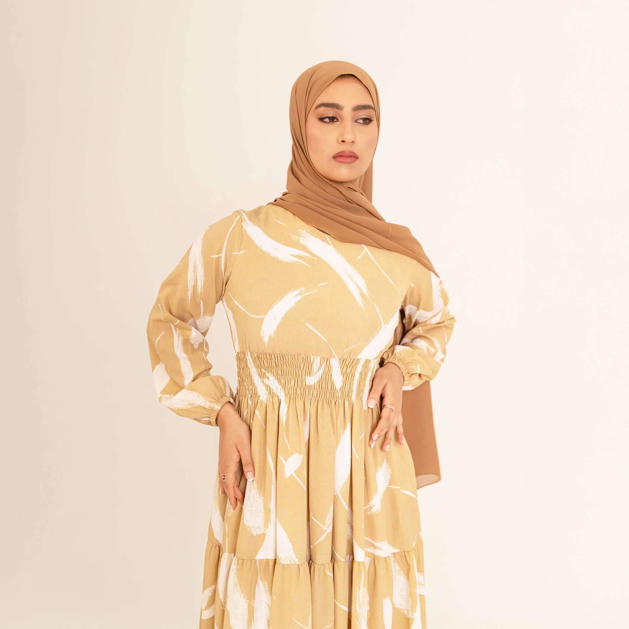 Noor champagne feather-print dress, bodice and shirred waist detail