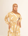 Noor champagne feather-print dress, bodice and shirred waist detail